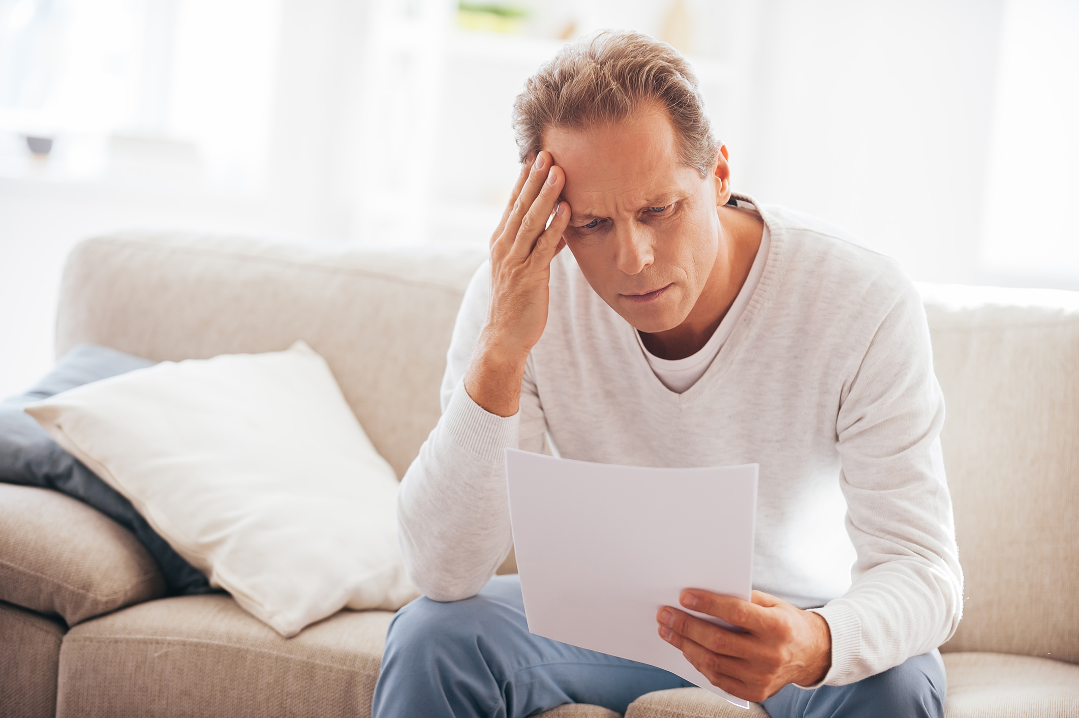 Man struggling to read cable bill