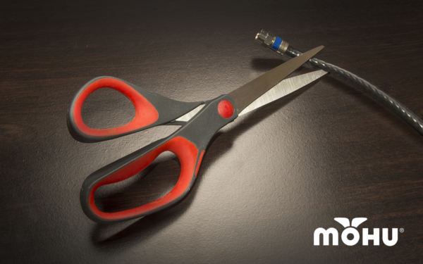 Scissors cutting a coax cable with the Mohu Logo