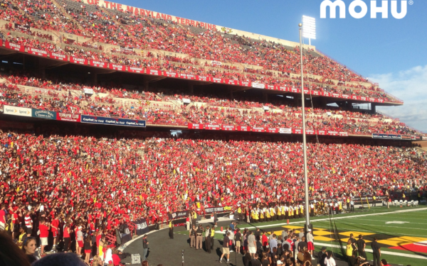 football stadium showing bleachers filled with fans with mohu logo