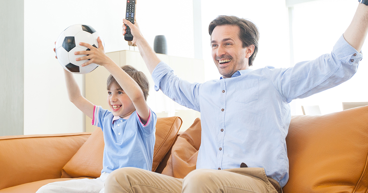 father and son watching TV